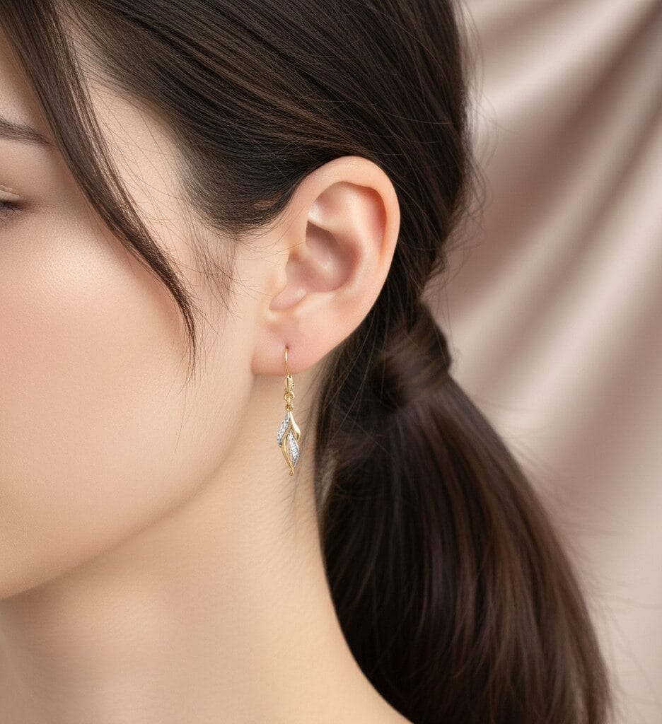 Wiszące kolczyki z żółtego złota z cyrkoniami ucho