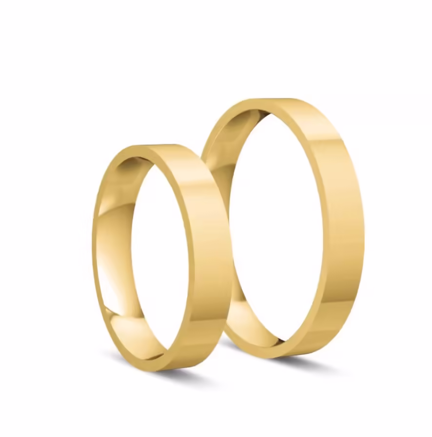 Klasyczne płaskie obrączki z żółtego złota o szerokości 3,5 mm.