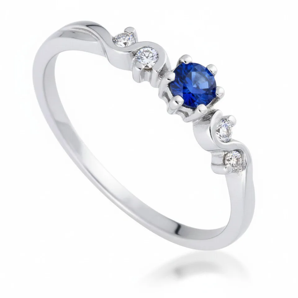 Pierścionek zaręczynowy Elysia z białego złota z okrągłym szafirem i diamentami GESELLE