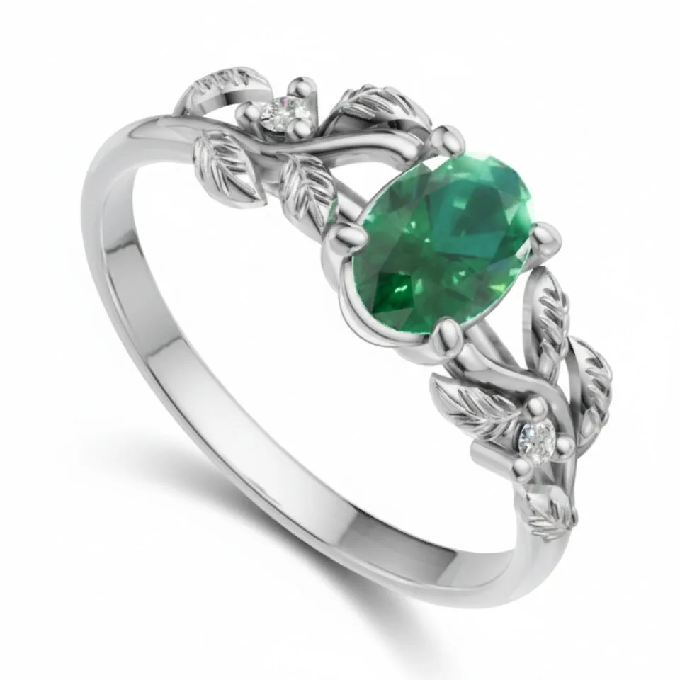 Pierścionek zaręczynowy Ornelia z białego złota z szmaragdem i diamentami GESELLE